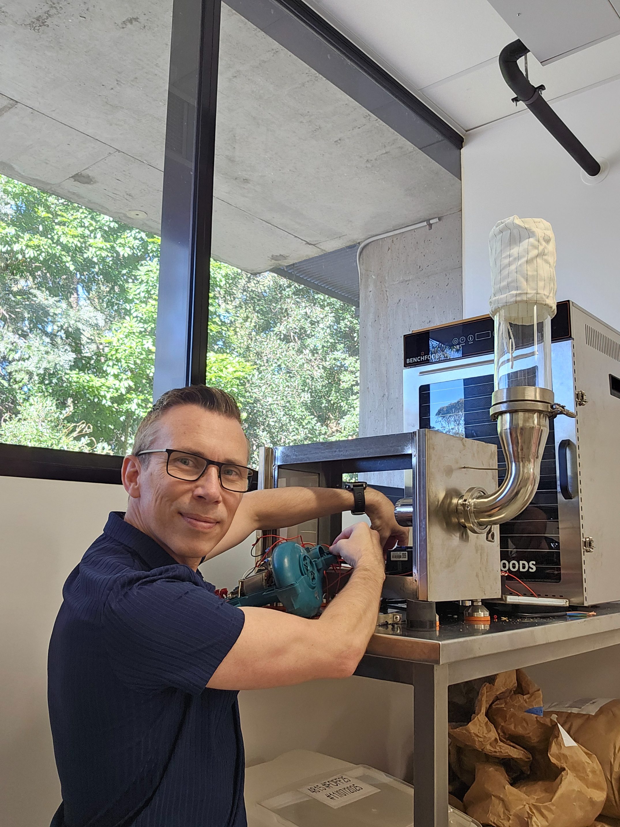 Kevin Kelly wiring the fluidized bed dryer at UQ